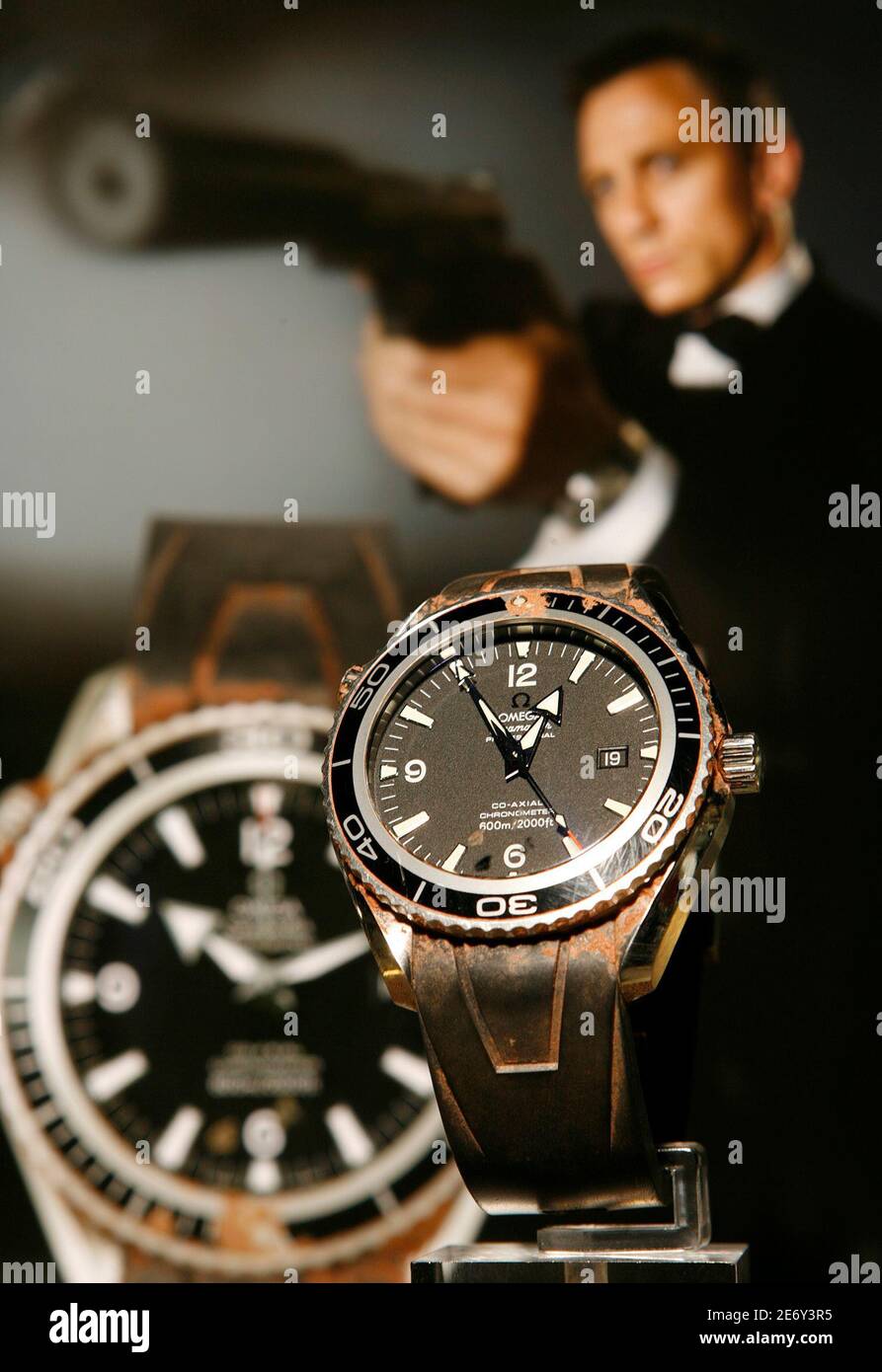 The Omega, 'Seamaster Planet Ocean' watch worn by Daniel Craig during the  filming of 'Casino Royale' in 2005/2006, is pictured in front of a  promotional photo during a preview at Antiquorum auction