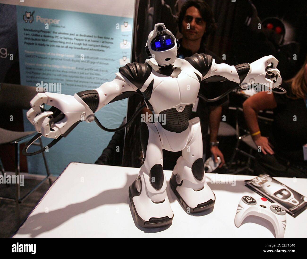 Robosapien" stretches after his nap at the DigitalLife showcase in New York  October 14, 2005. The small robot, made by WowWee, has a remote control and  sensors that not only allow it