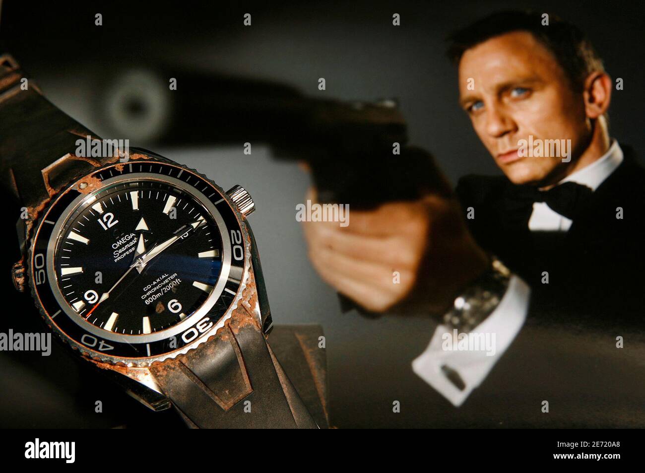 The Omega, 'Seamaster Planet Ocean' watch worn by Daniel Craig during the  filming of 'Casino Royale' in 2005/2006, is pictured in front of a  promotional photo during a preview at Antiquorum auction