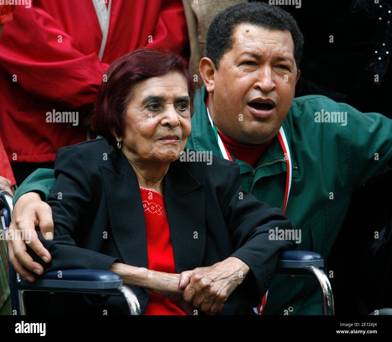 Venezuelan President Hugo Chavez sings mariachi songs to Ana Maria Zapata,  daughter of Mexican revolutionary hero Emiliano Zapata, as they attend the  inauguration of an exhibition about Zapata on the 90th anniversary