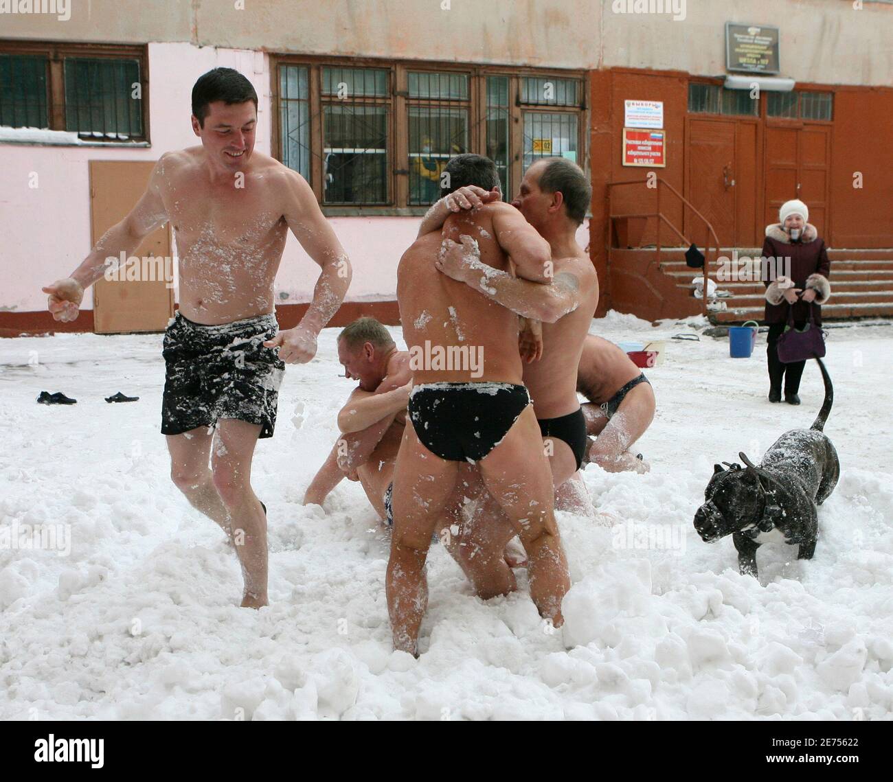 Men from a "Polar Bear" sports society play in the snow in front of a  polling station after voting in Barnaul March 2, 2008. Russians voted for a  new president on Sunday