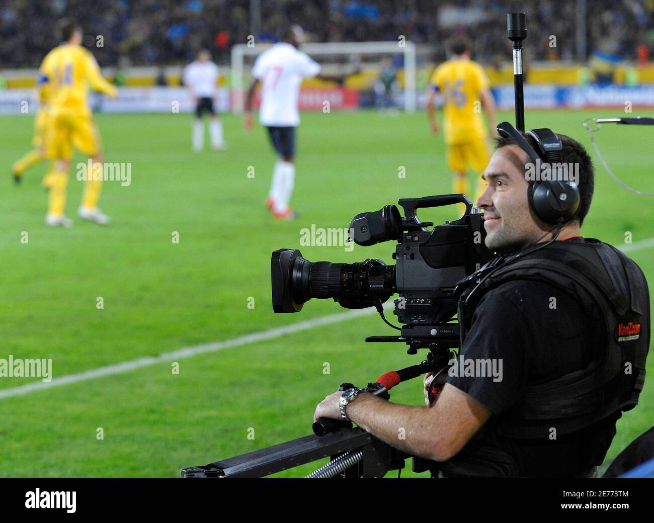 A television camera operator works during the World Cup 2010 qualifying  soccer match between Ukraine and England at the Dnipro Arena in  Dnipropetrovsk October 10, 2009. England fans will only be able