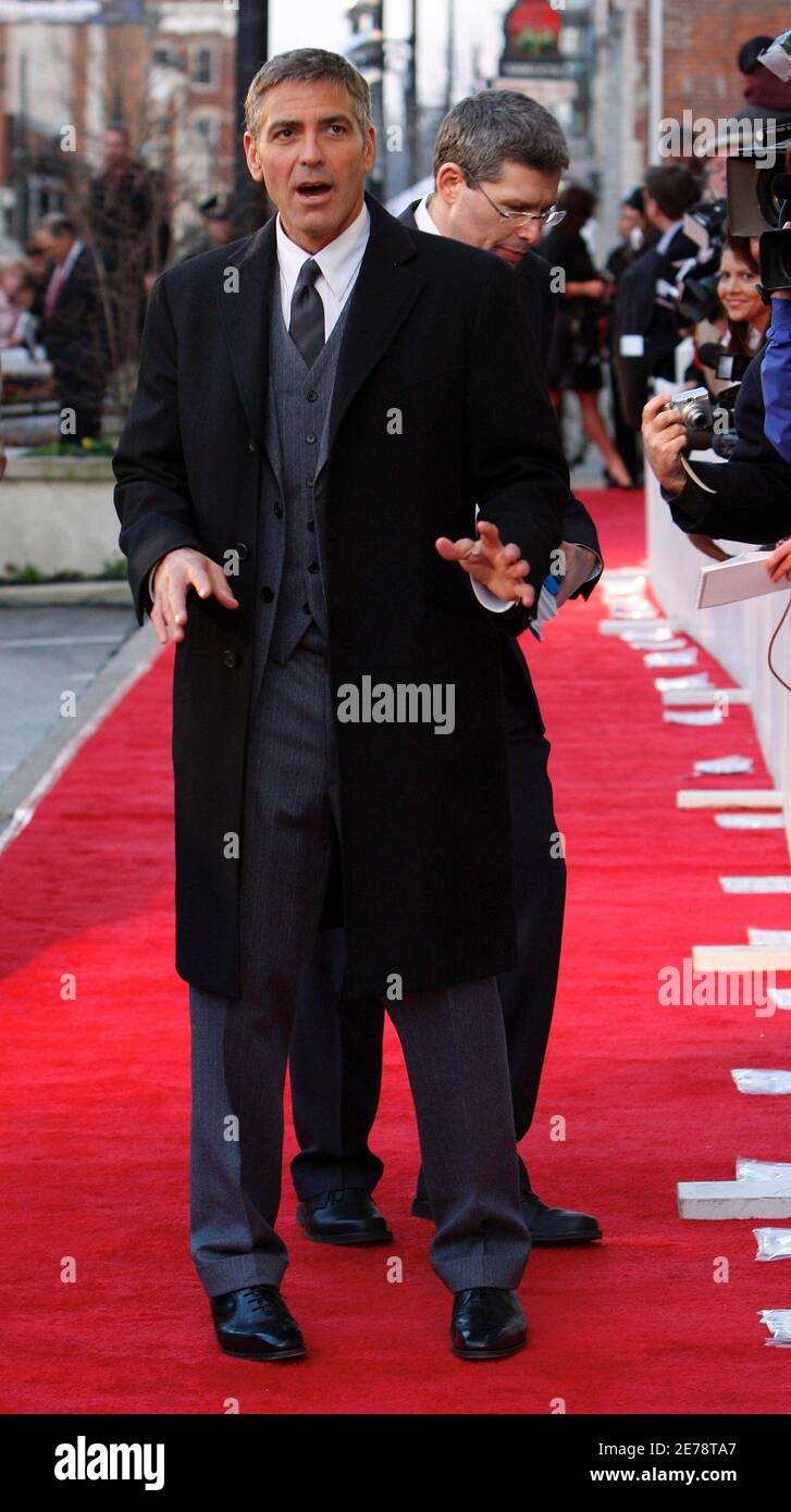 Actor George Clooney reacts to the media on the red carpet during the  premiere of his new movie Leatherheads in his home town of Maysville,  Kentucky March 24, 2008. REUTER/John Sommers II (