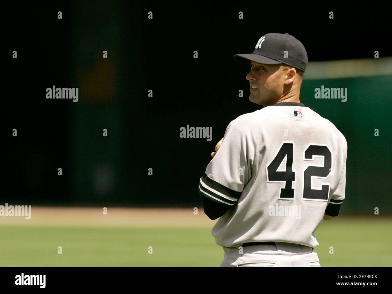 New York Yankees Shortstop Derek Jeter Wears The Number 42 On His Jersey As  A Tribute