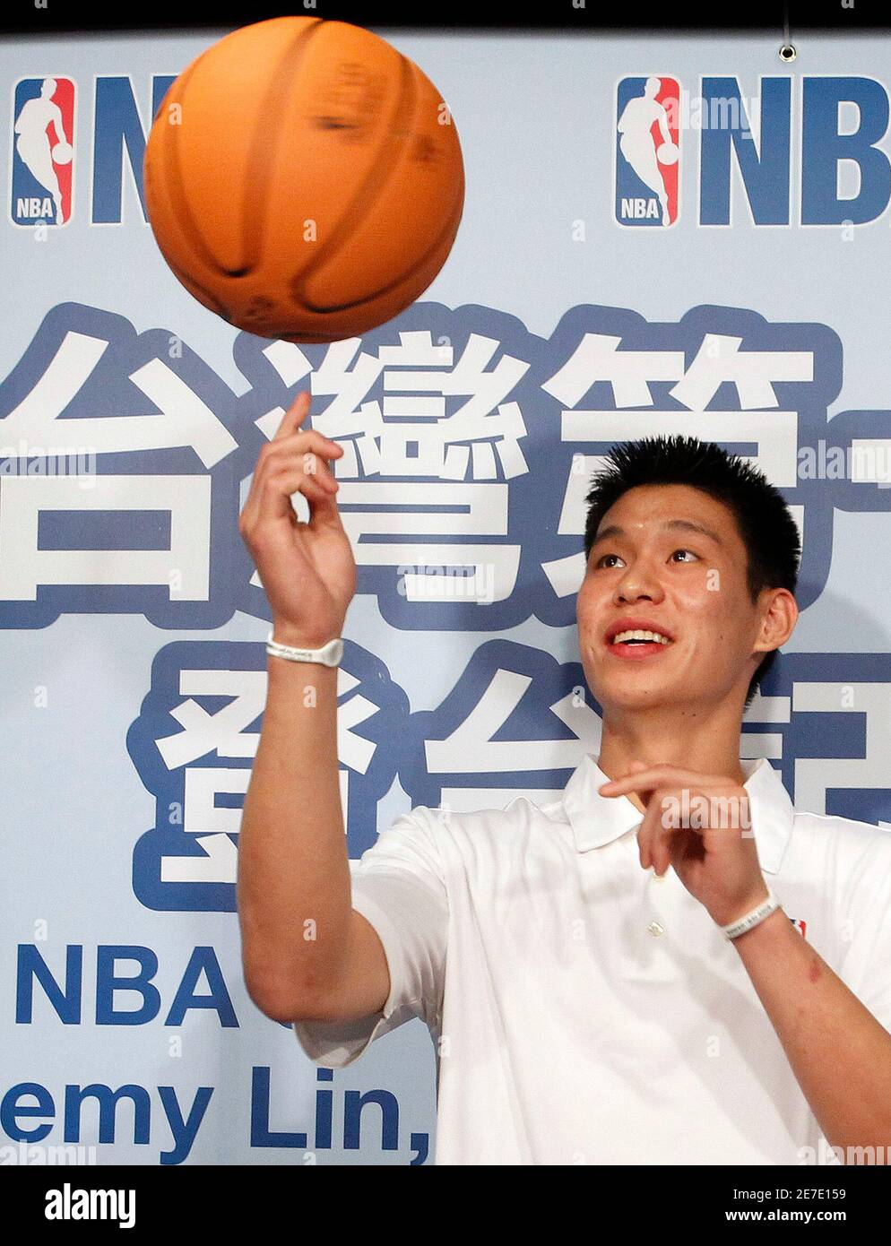 NBA player Jeremy Lin of the Golden State Warriors poses for the media  during a news conference in Taipei July 28, 2010. Lin, the first person of  Taiwanese descent to join the