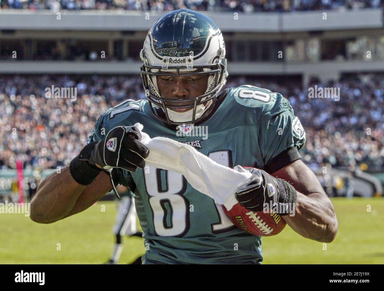 Philadelphia Eagles wide receiver Terrell Owens pulls a towel from his  uniform for a celebration after scoring his 100th career touchdown against  the San Diego Chargers in Philadelphia in this October 23,