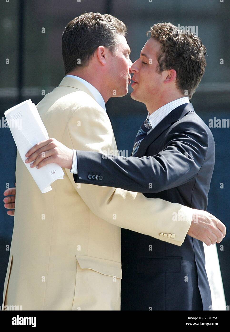 miami-dolphins-former-quarterback-marino-is-kissed-by-son-during-induction-into-pro-football-hall-of-fame-ohio-daniel-marino-r-kisses-his-father-dan-marino-miami-dolphins-former-quarterback-during-dans-induction-into-the-pro-football-hall-of-fame-in-canton-ohio-august-7-2005-reuters-aaron-josefczyk-2e7p25c.jpg