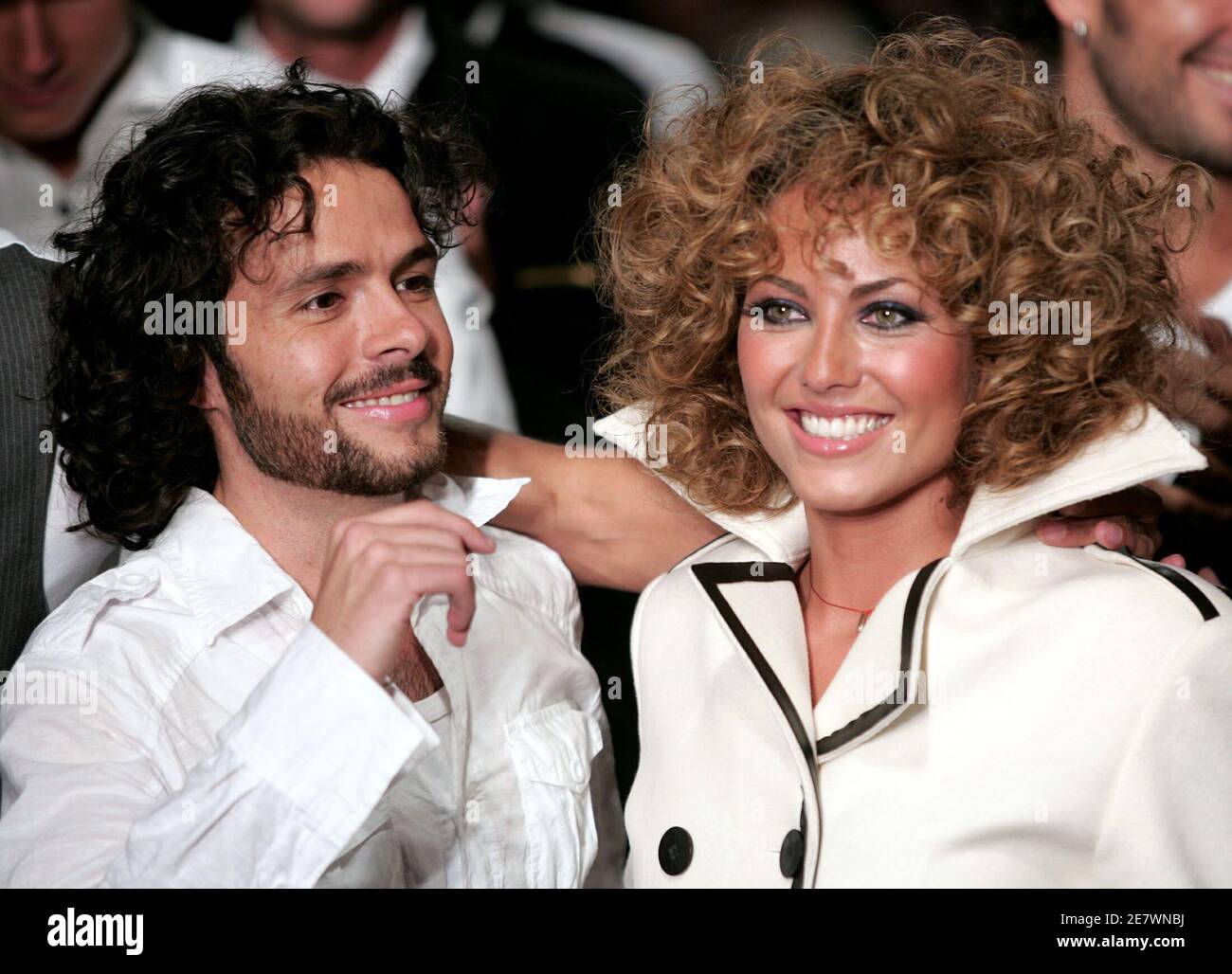 Mexican designer Jose Maria Torre Hutt smiles with Uruguayan actress and  model Barbara Mori as he presents his Automn/Winter creation collection  during the Mexico fashion week in Mexico City, April 5, 2006.