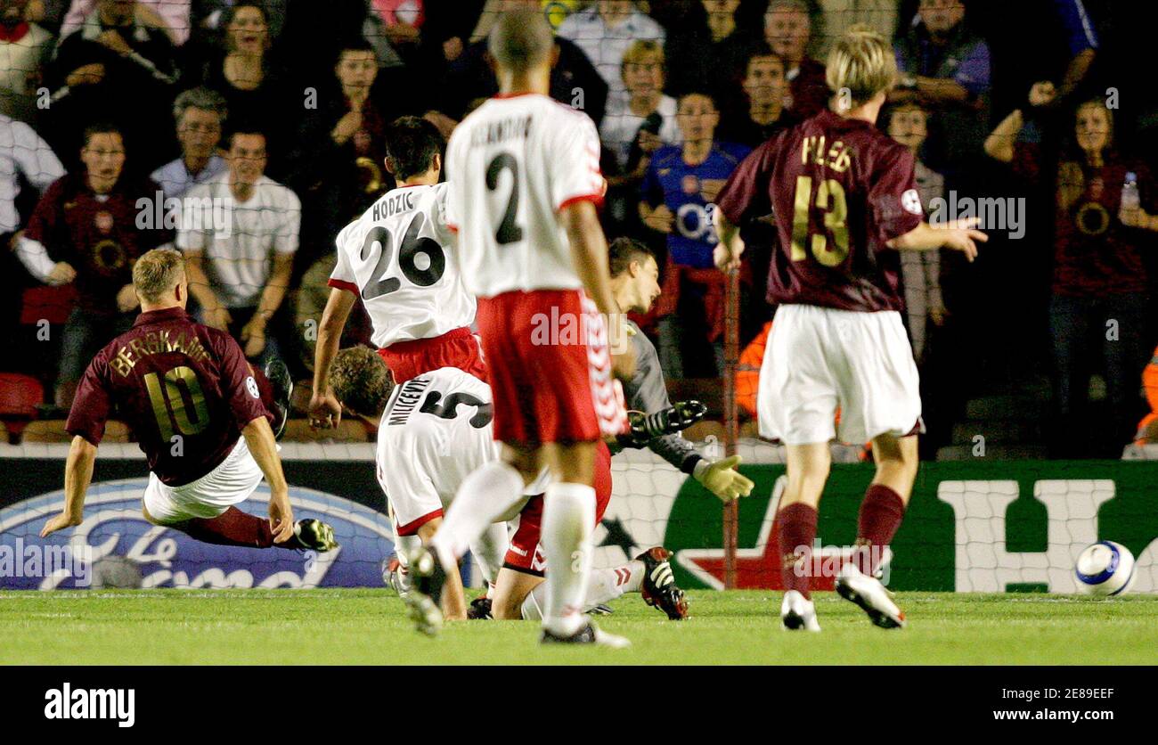 Arsenal S Bergkamp Scores The Winning Goal Against Thun During Their Champions League Group B Soccer Match In London Arsenal S Alexandr Hleb R Watches As Team Mate Dennis Bergkamp L Scores The Winning Arsenal S Bergkamp Scores The Winning Goal Against Thun During Their Champions League Group B Soccer Match In London Arsenal S Alexandr Hleb R Watches As Team Mate Dennis Bergkamp L Scores The Winning