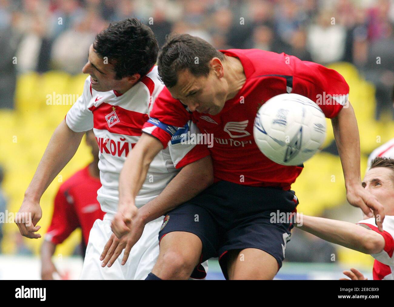 Sergei Ignashevich of CSKA Moscow (R) fights for the ball with Nikita  Bazhenov of Spartak Moscow during their Russian Cup final match in Moscow  May 20, 2006. CSKA kept hold of the