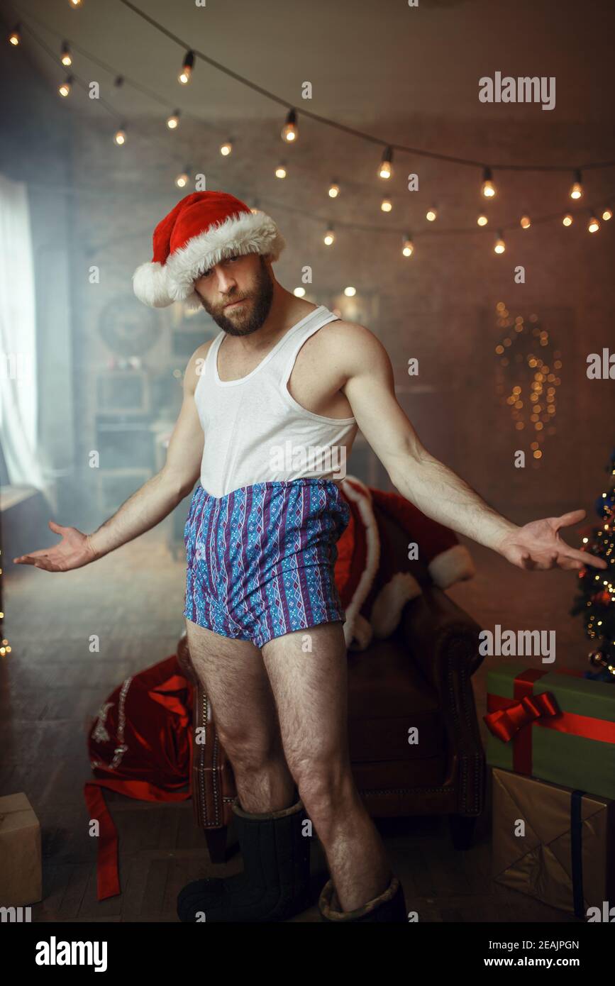 Mal desvergonzado Santa claus en pantalones, humor Foto de stock