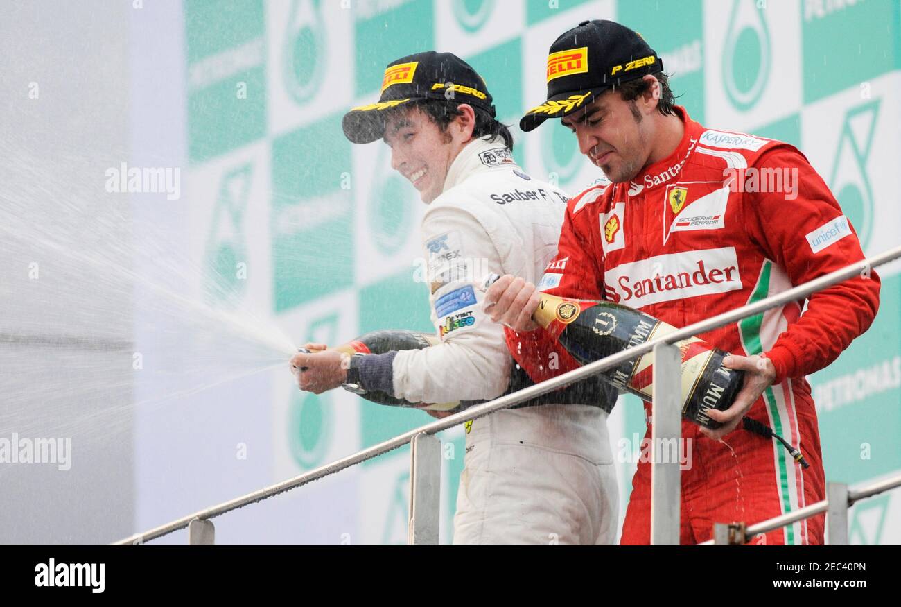 Fórmula uno - F1 - Gran Premio de Malasia 2012 - circuito Internacional  Sepang, Kuala Lumpur, Malasia - 25/3/12 Fernando Alonso de Ferrari celebra  ganar la carrera con el segundo puesto Sergio