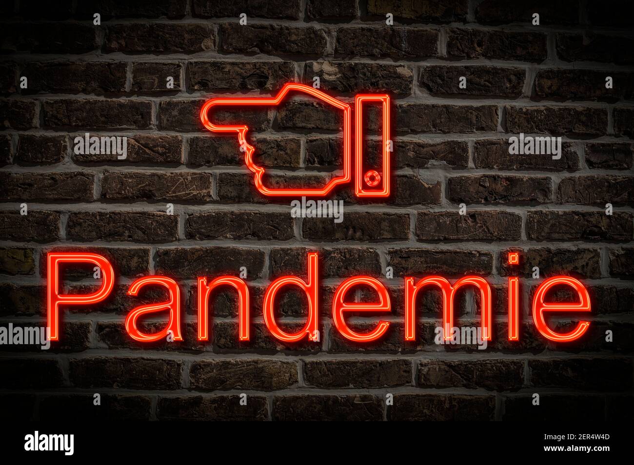 Foto detallada de un cartel de neón en una pared con La inscripción Pandemie (pandemia) Foto de stock