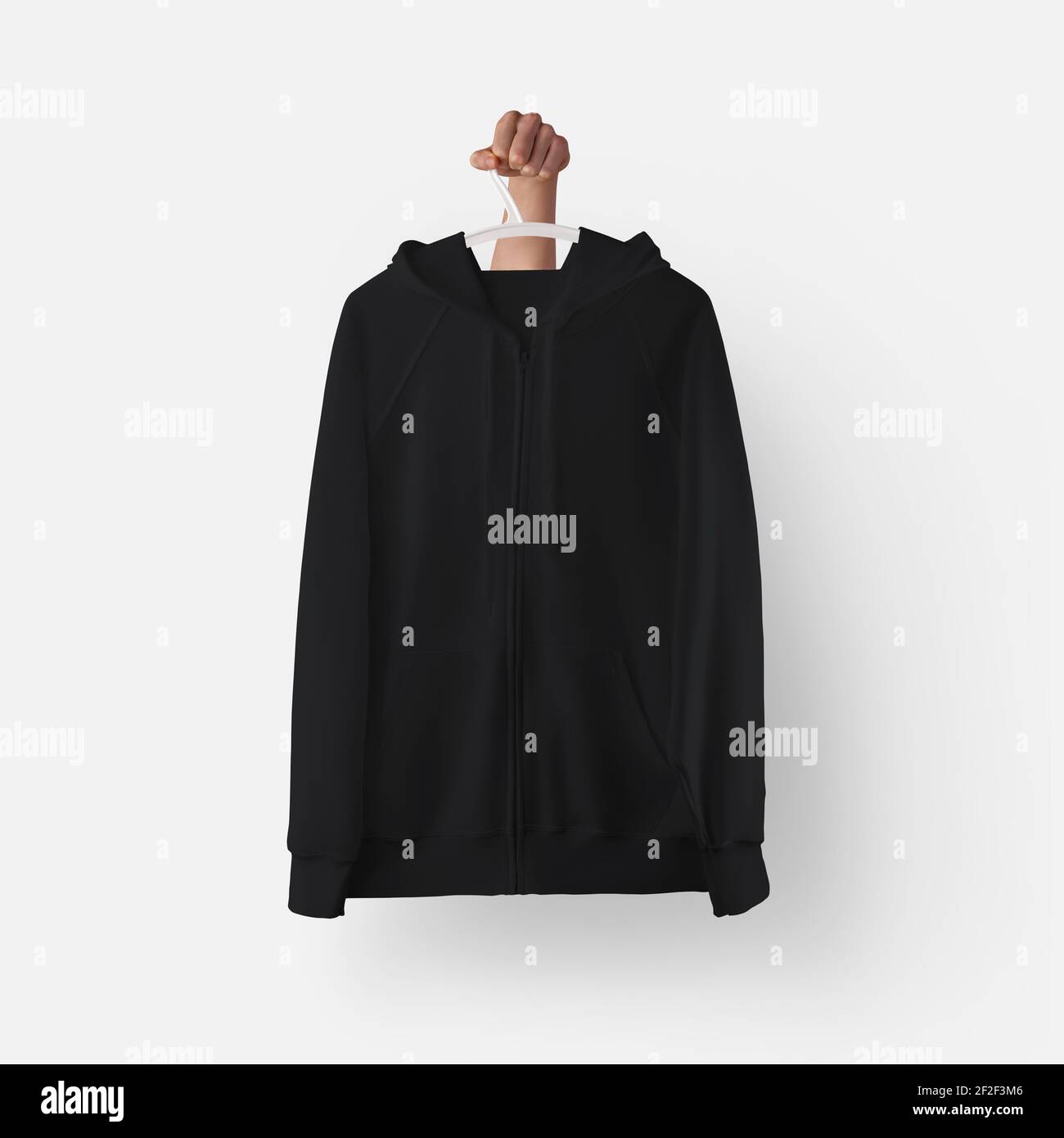 Plantilla de sudadera con capucha texturizada negra con cremallera,  bolsillo colgado en una percha de plástico en la mano, vista frontal para  la presentación del diseño, estampado. Burla de cl. Casual Fotografía