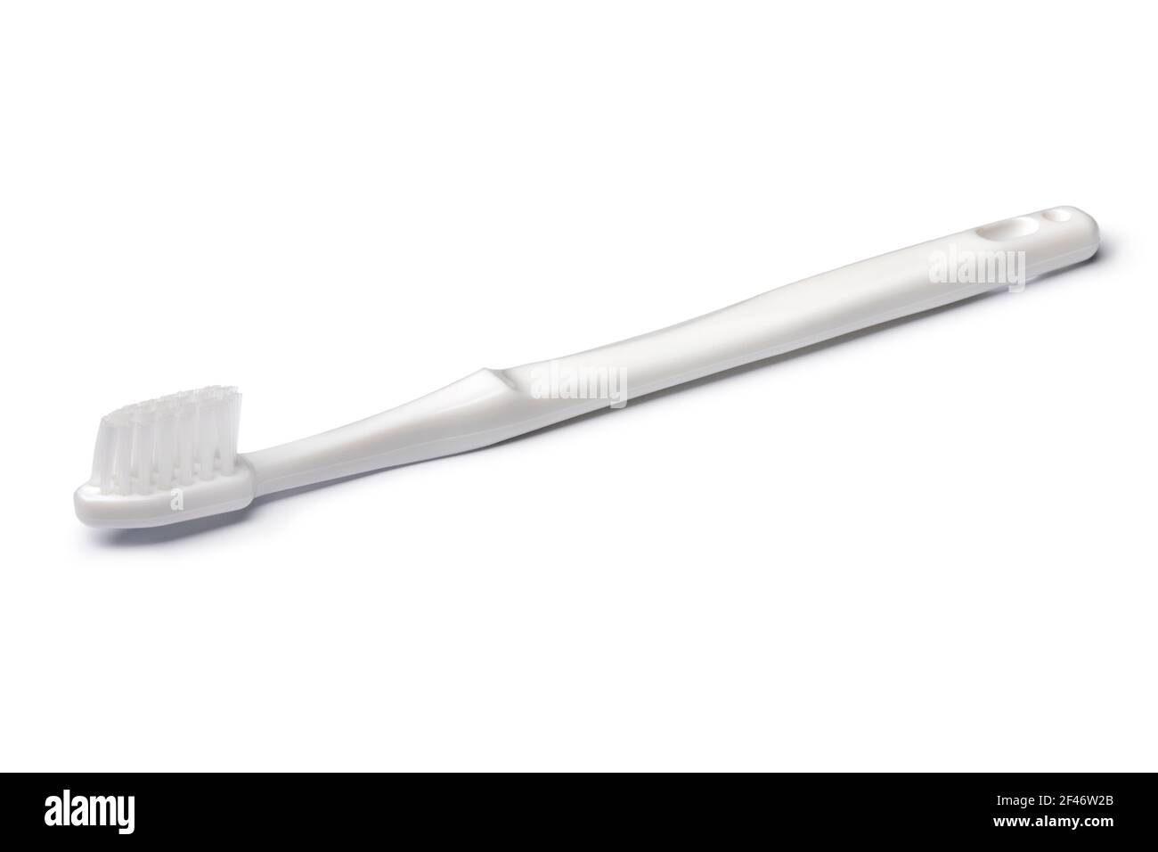 Cepillo de dientes de plástico aislado sobre fondo blanco Foto de stock