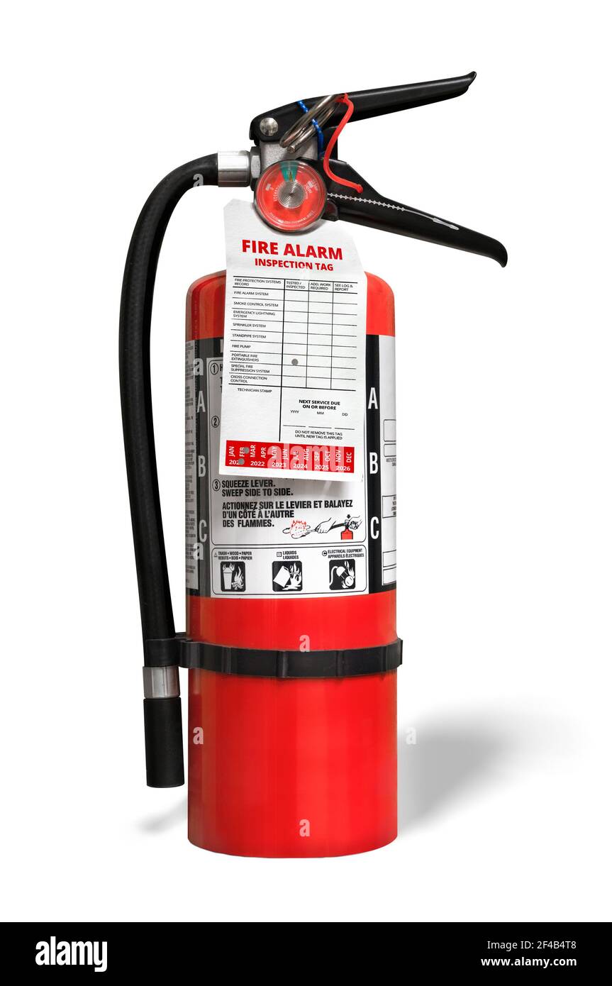 Extintor de incendios con etiqueta de inspección. Extintor portátil ABC o seco multiuso con fosfato monoamónico. Aislado sobre blanco de stock - Alamy
