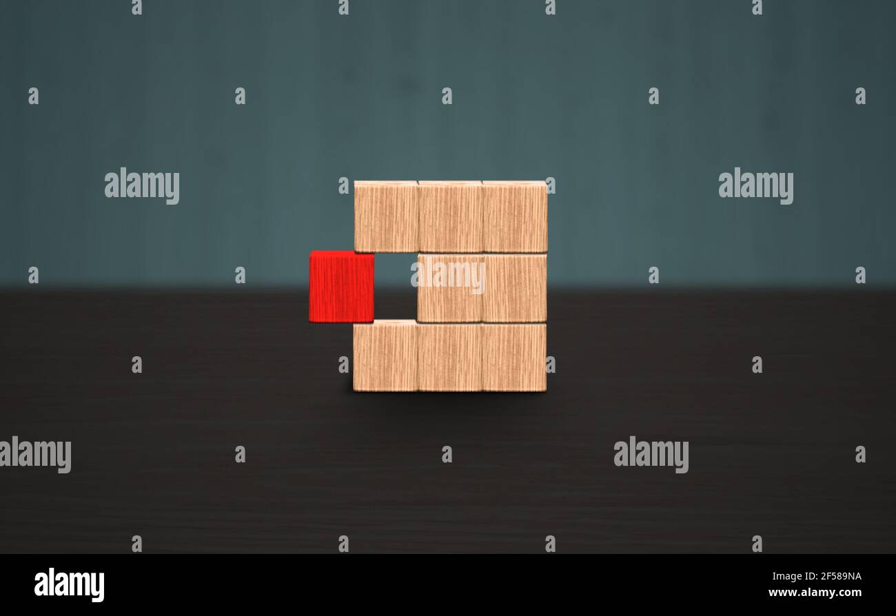 Distinguir un bloque rojo de otro concepto de líder. Caja de madera de bloque vacía con 1 bloques rojos distintivos. Fondo de madera con espacio para copias. Foto de stock