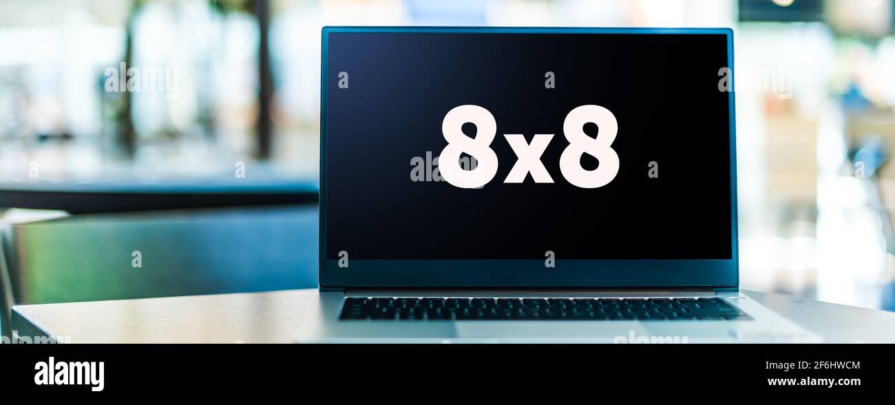 POZNAN, POL - FEB 6, 2021: Ordenador portátil mostrando el logotipo de 8x8 Inc., un proveedor de productos de voz sobre IP, como voz basada en la nube, centro de contacto, vi Foto de stock