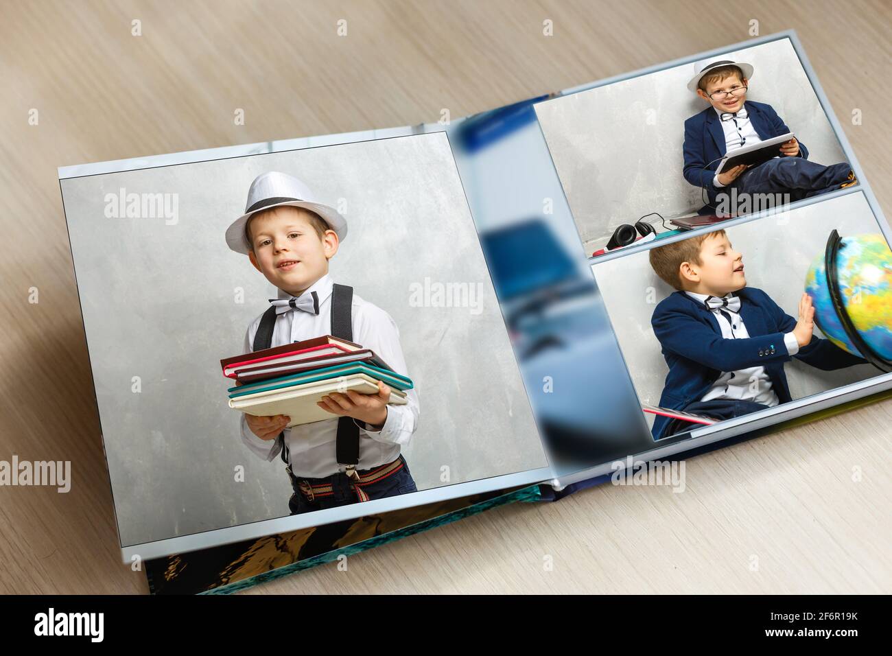 pequeño niño graduación fotolibro, álbum de la escuela Fotografía de stock  - Alamy
