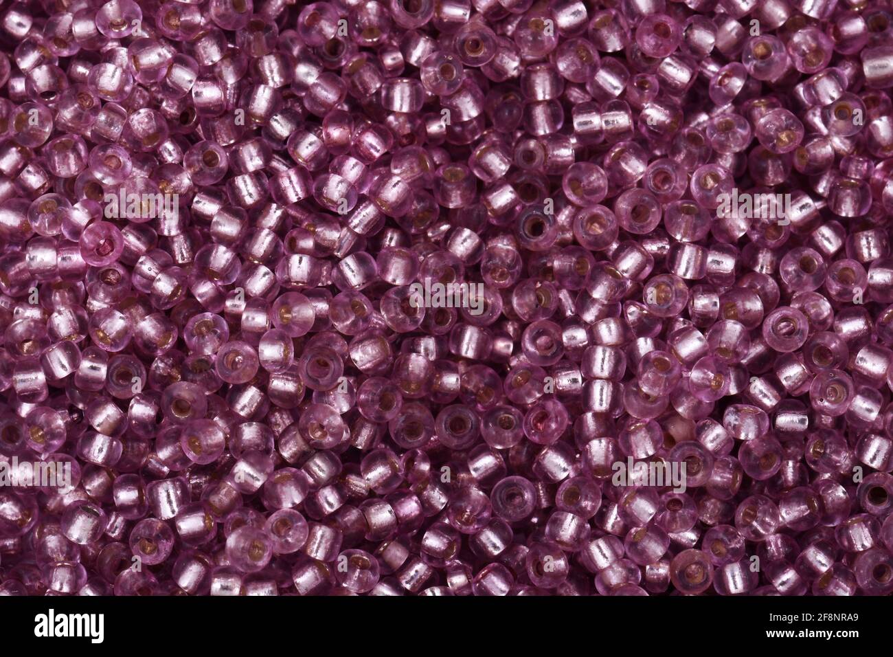 Cuentas brillantes rosas de primer plano de fondo Foto de stock