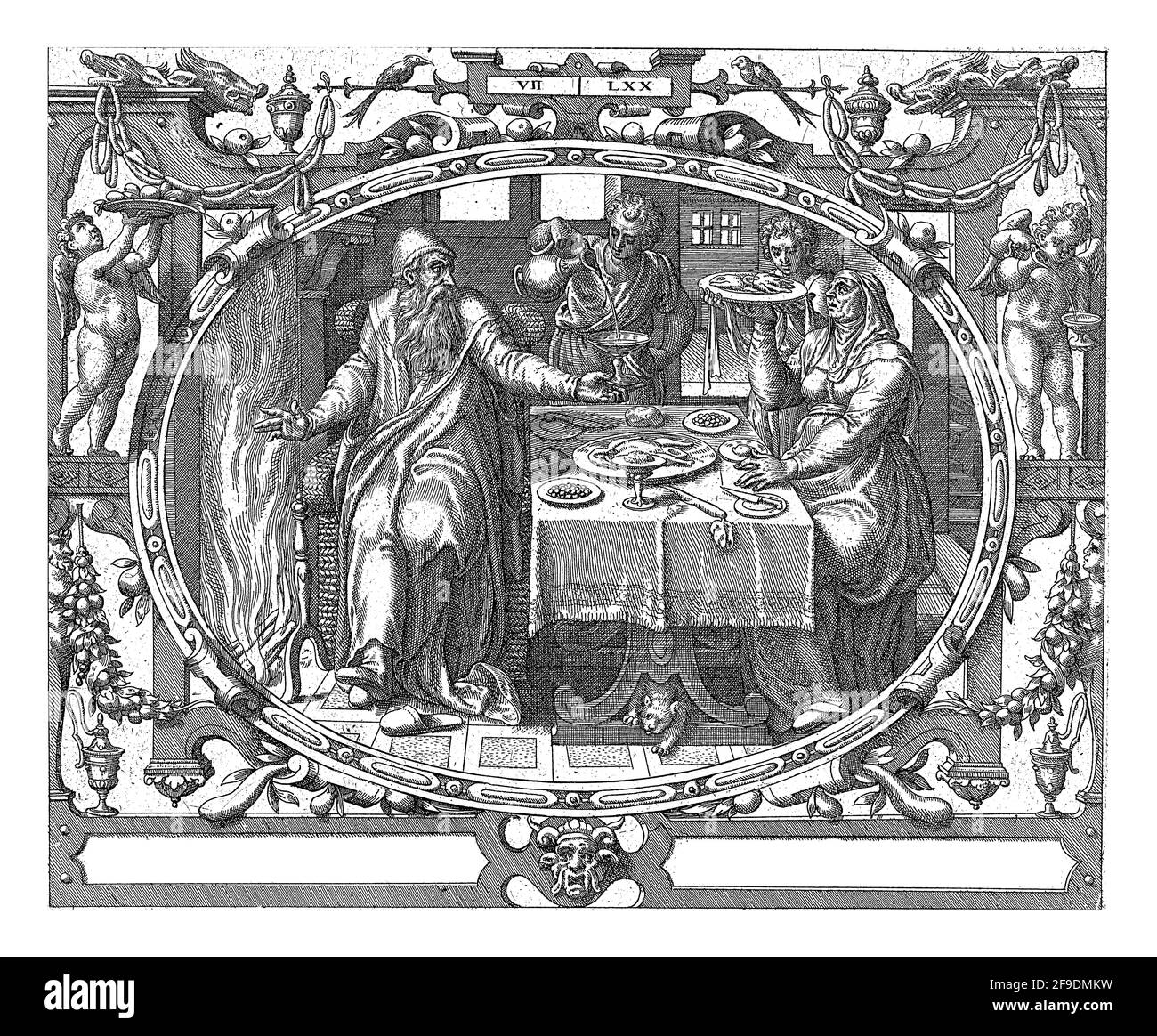 En un marco oval decorado con ornamentos, una representación de un anciano y su esposa en la mesa junto a la chimenea. Los sirvientes les sirven comida y bebida. Foto de stock