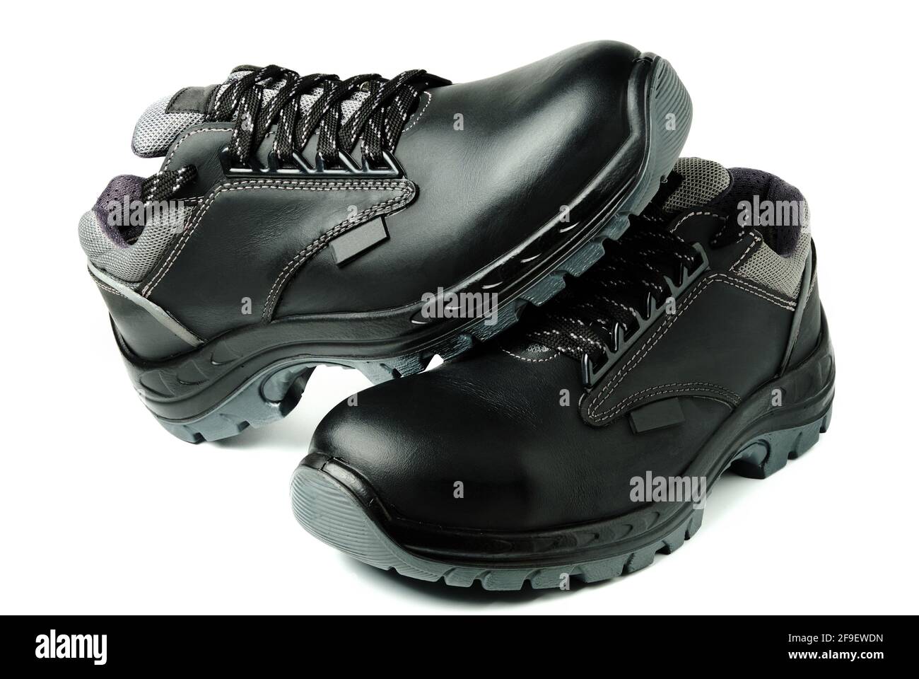 Botas de seguridad de trabajo negro aisladas sobre blanco de stock - Alamy