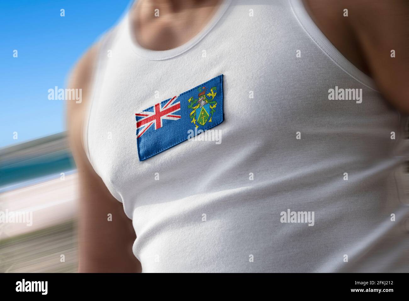 La bandera nacional de las Islas Pitcairn en el pecho del atleta Foto de stock