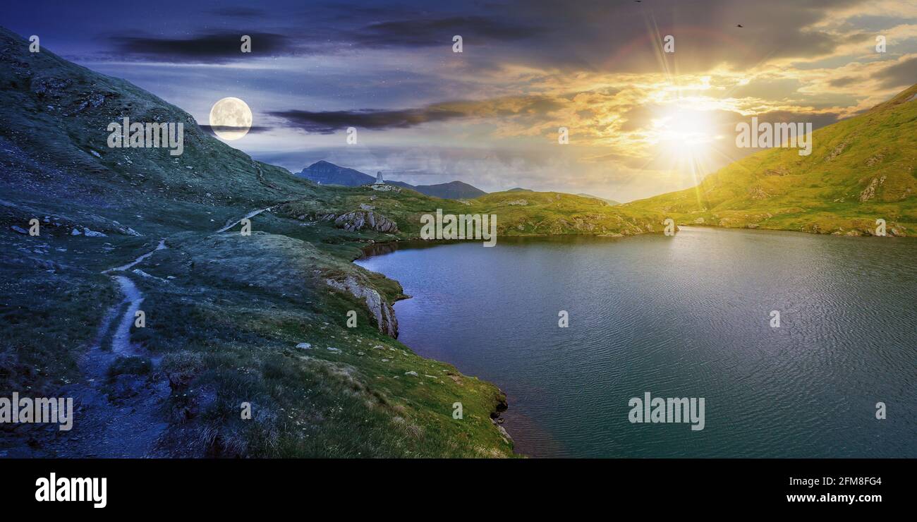 la hora del día y la noche cambian de concepto sobre el paisaje del verano con el lago en la altitud alta. hermoso paisaje de la cresta de la montaña de fagaras. vista abierta adentro al Foto de stock