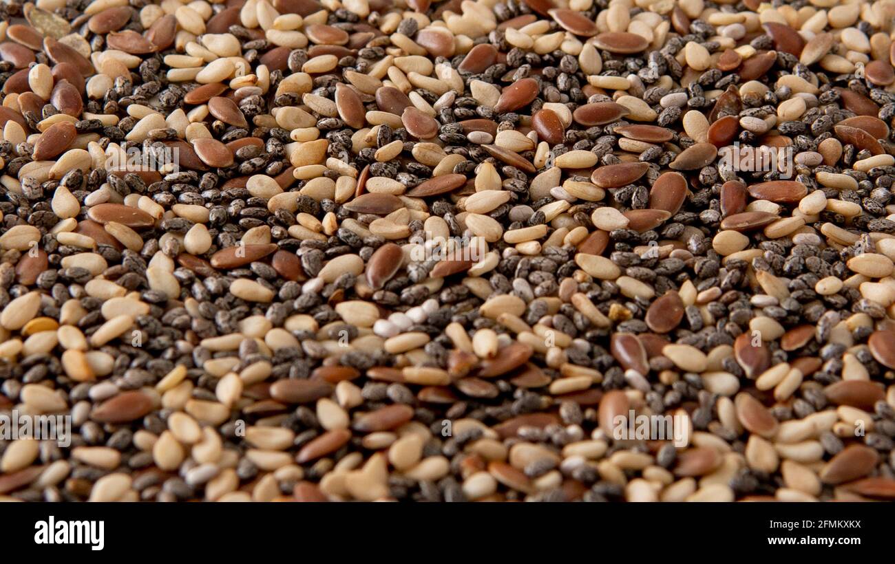 Vista de fondo de mezcla de chía, lino y semillas de sésamo Fotografía de  stock - Alamy