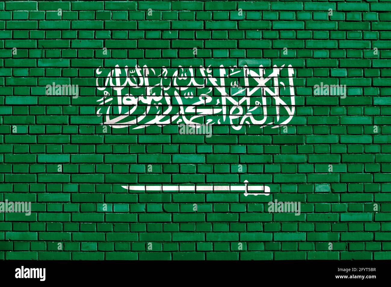 Bandera de Arabia Saudita pintada en pared de ladrillo Foto de stock