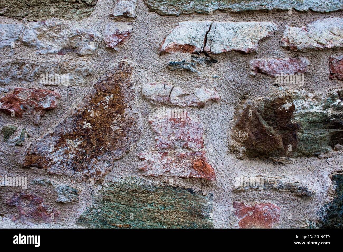 Vista de cerca del fondo de la antigua pared de piedra. Foto de stock