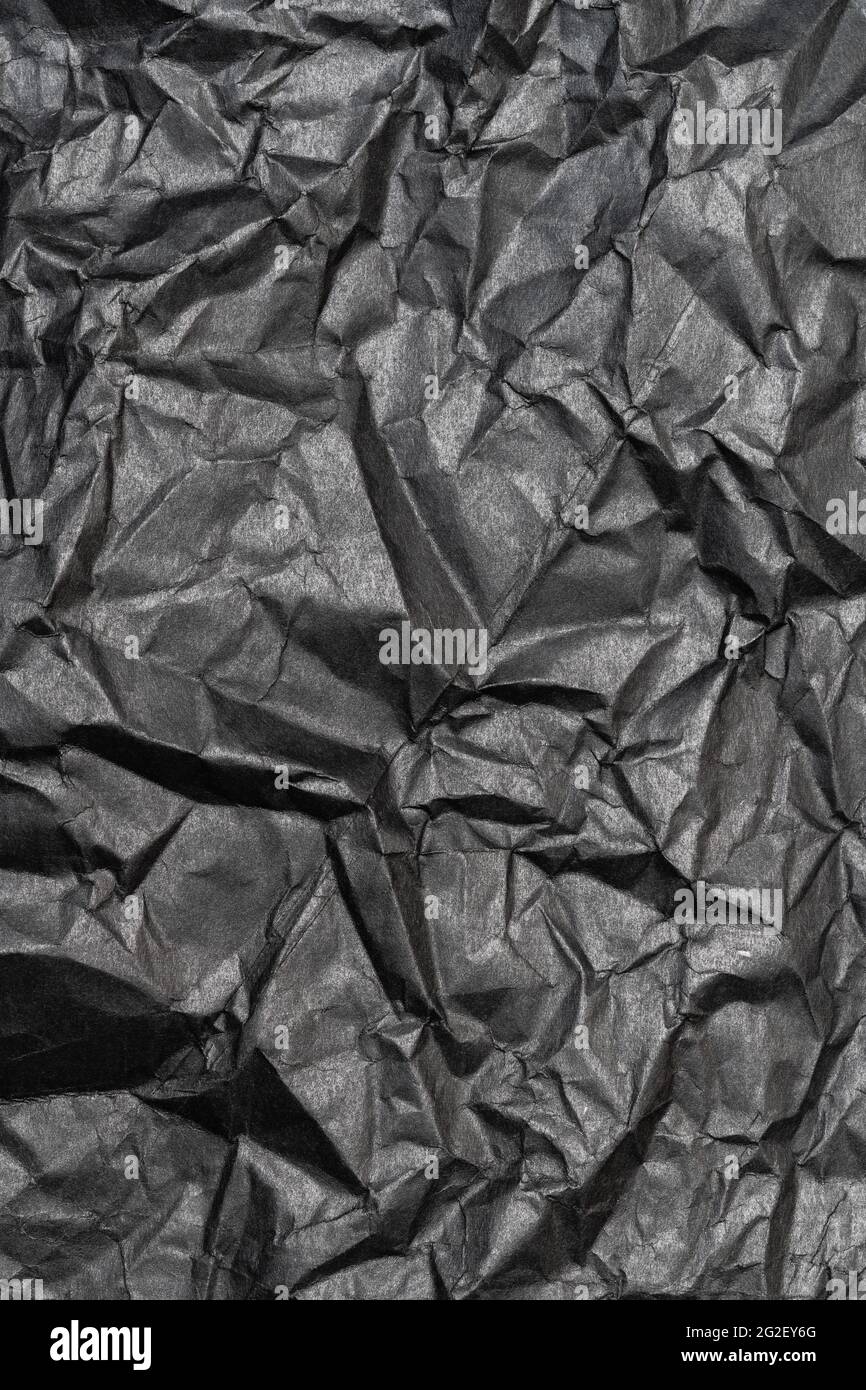 Fondo de color negro de la hoja de cartón arrugado, vista vertical de  textura abstracta de material de cartón arrugado, fondo de patrón  Fotografía de stock - Alamy