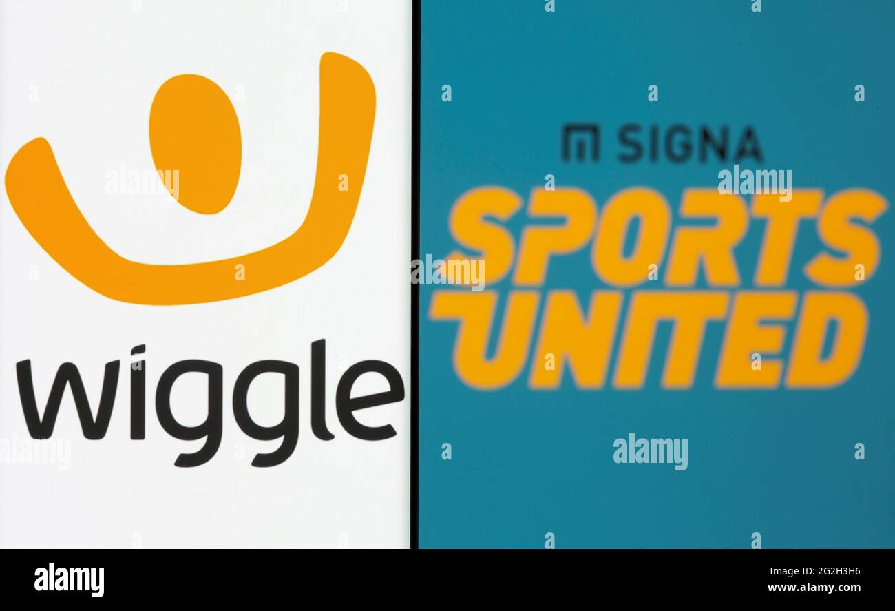 El logotipo de Wiggle se ve en un smartphone delante de un logotipo de