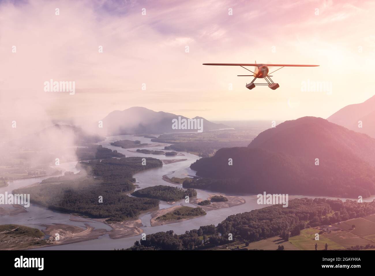 Imagen compuesta de 3D CGI Seaplane volando sobre el valle Foto de stock