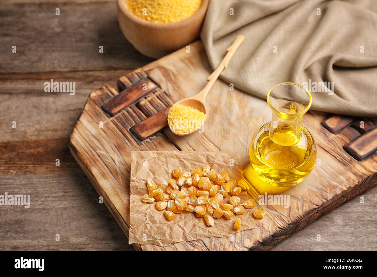 Composición con aceite de maíz, granos