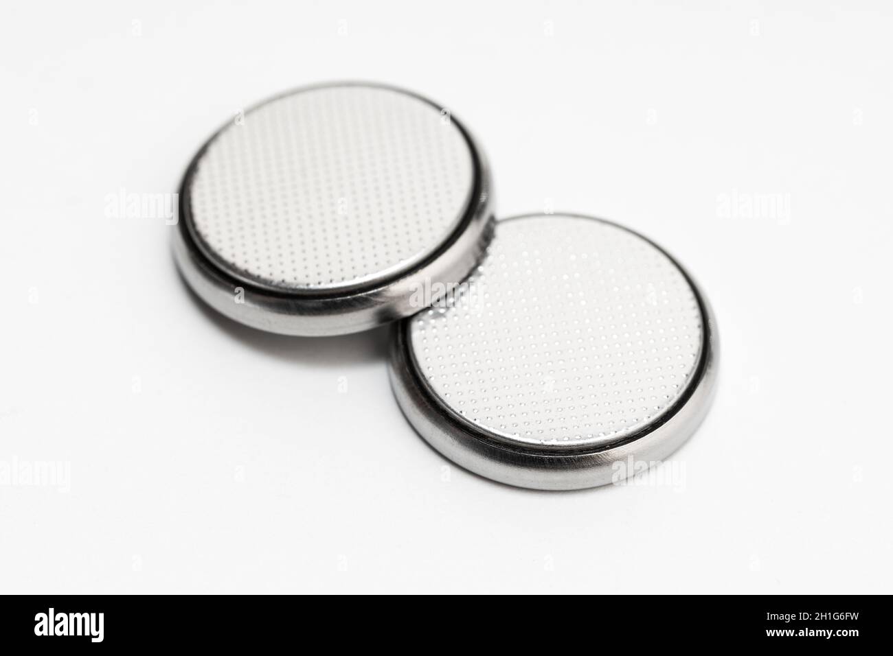 Jajaja posibilidad Depresión Pila de botón o pila de botón aislada sobre fondo blanco Fotografía de  stock - Alamy