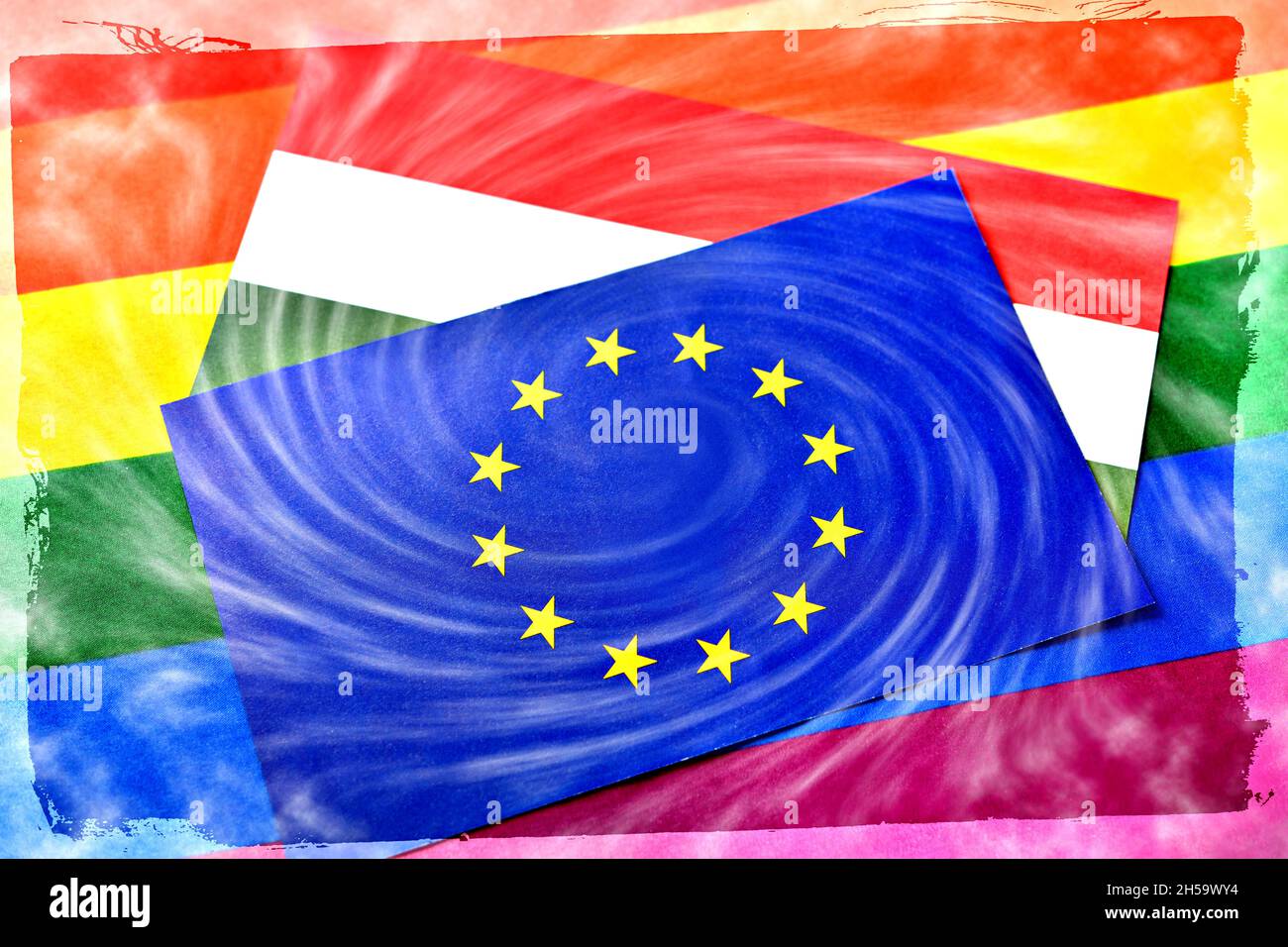 FOTOMONTAGE, Fahnen von EU und Ungarn mit Sturmwolken und Regenbogenfahne, Streit um ungarisches LGBTQ-Gesetz Foto de stock