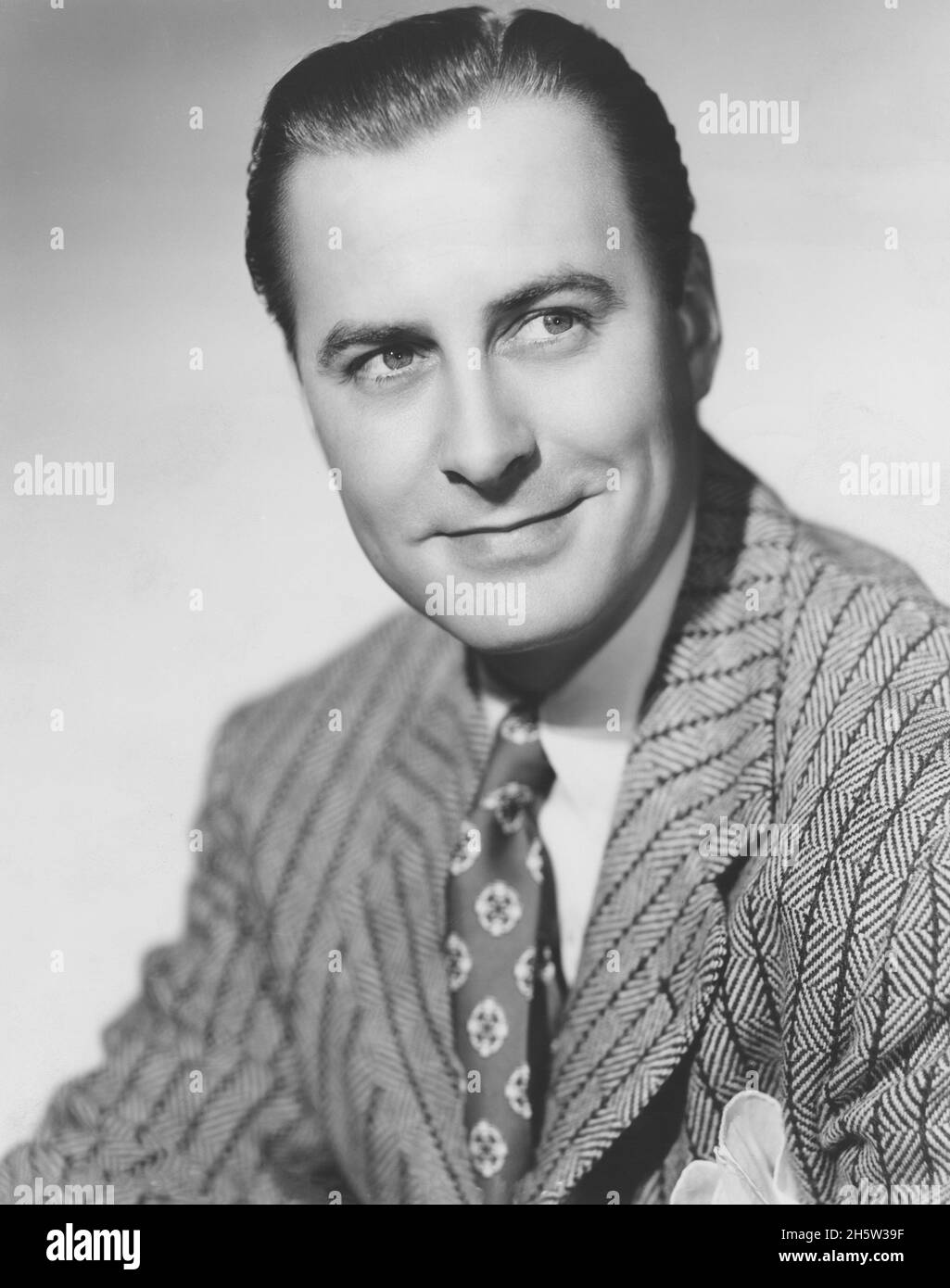 John Hubbard, Retrato Publicitario para la película, 'Usted nunca se enriquará', Columbia Pictures, 1941 Foto de stock