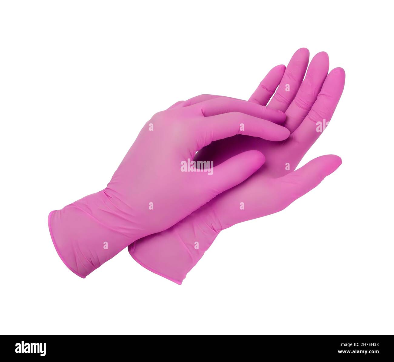 etc. en Vegetación Guantes médicos. Dos guantes quirúrgicos de color rosa aislados sobre fondo  blanco con las manos. Fabricación de guantes de goma, mano humana está  usando un guante de látex Fotografía de stock -