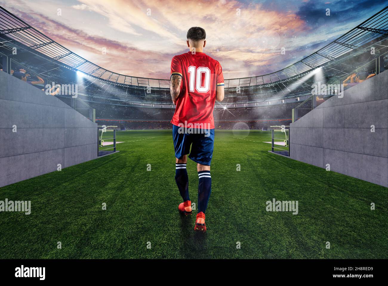Un jugador de fútbol con el número diez entra en el campo de juego del