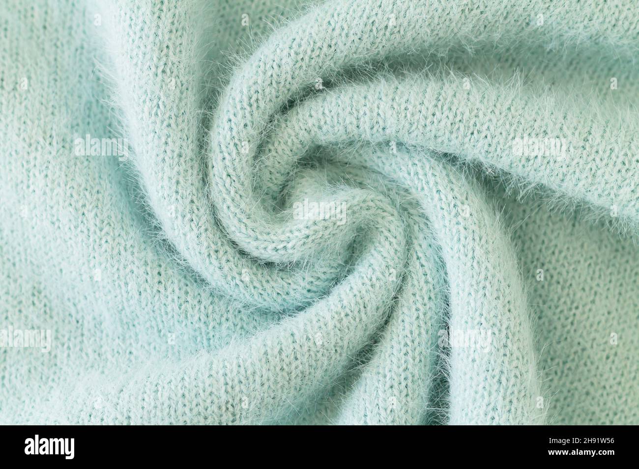 Remolino de tela de alpaca verde claro y textura de jersey de lana mohair  Fotografía de stock - Alamy