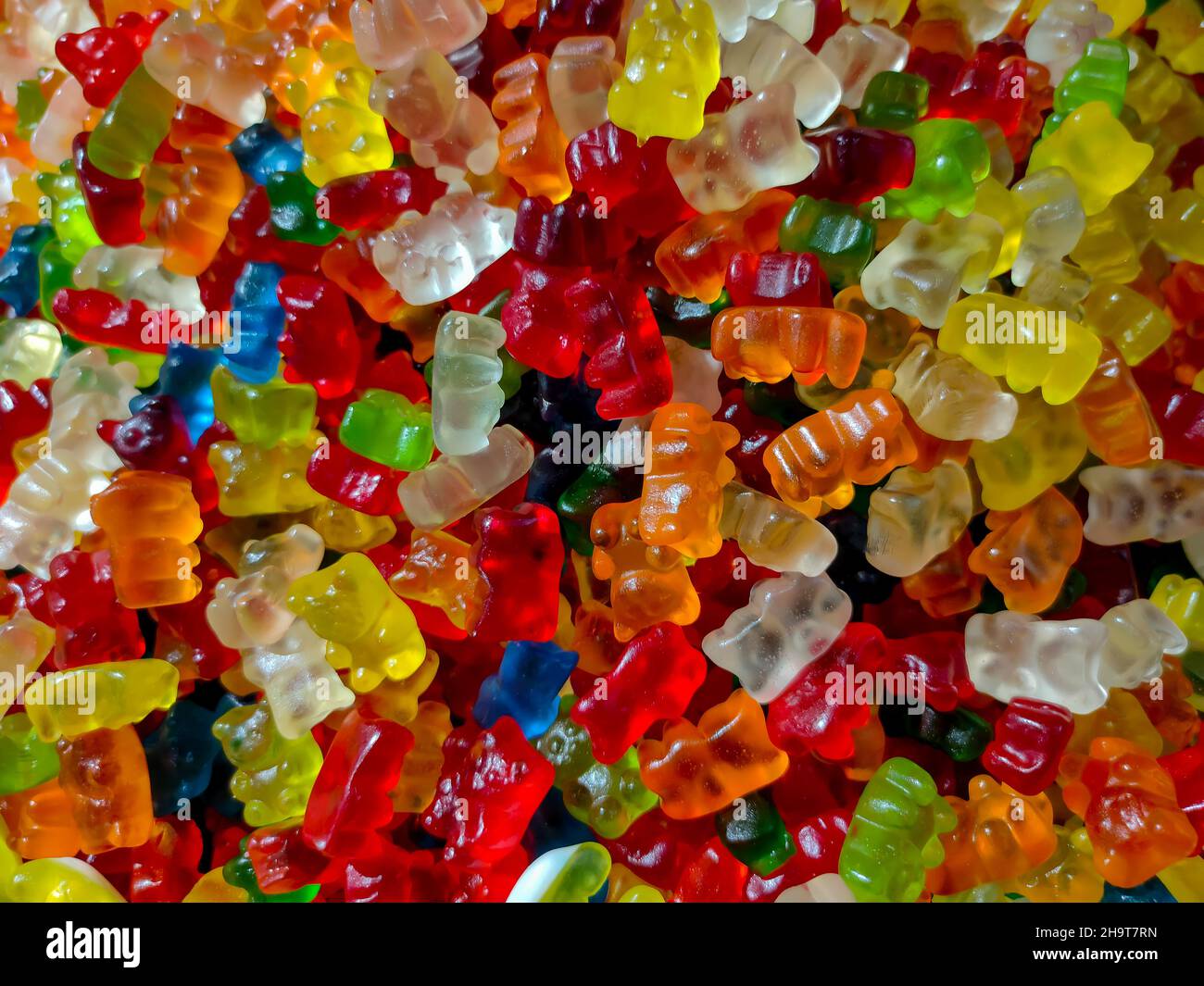 Antecedentes de caramelos de masticación multicolores de diferentes formas Foto de stock