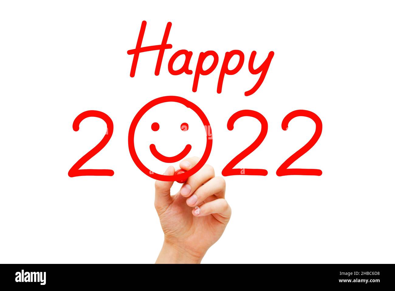Escritura de mano Feliz Año Nuevo 2022 y dibujo de cara sonriente con marcador rojo. Feliz concepto de vacaciones de Año Nuevo. Foto de stock