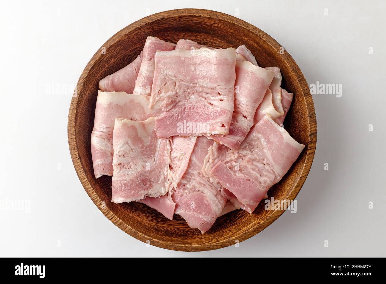 Bacon sobre un fondo blanco. Foto de stock