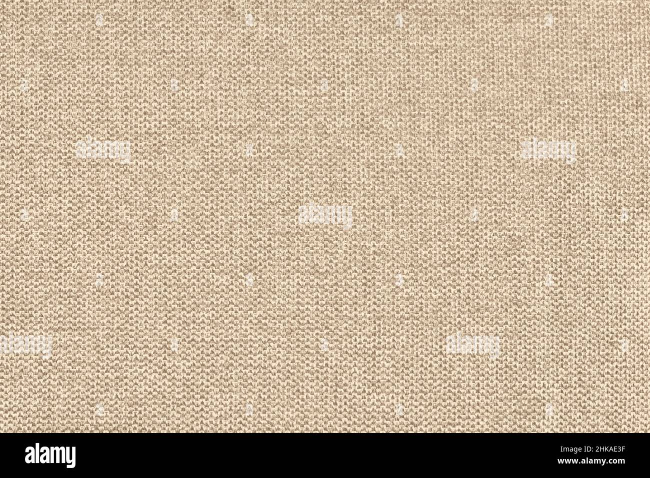 Sofá tejido de algodón beige cojín tela textura fondo. Fotografía de alta resolución Foto de stock