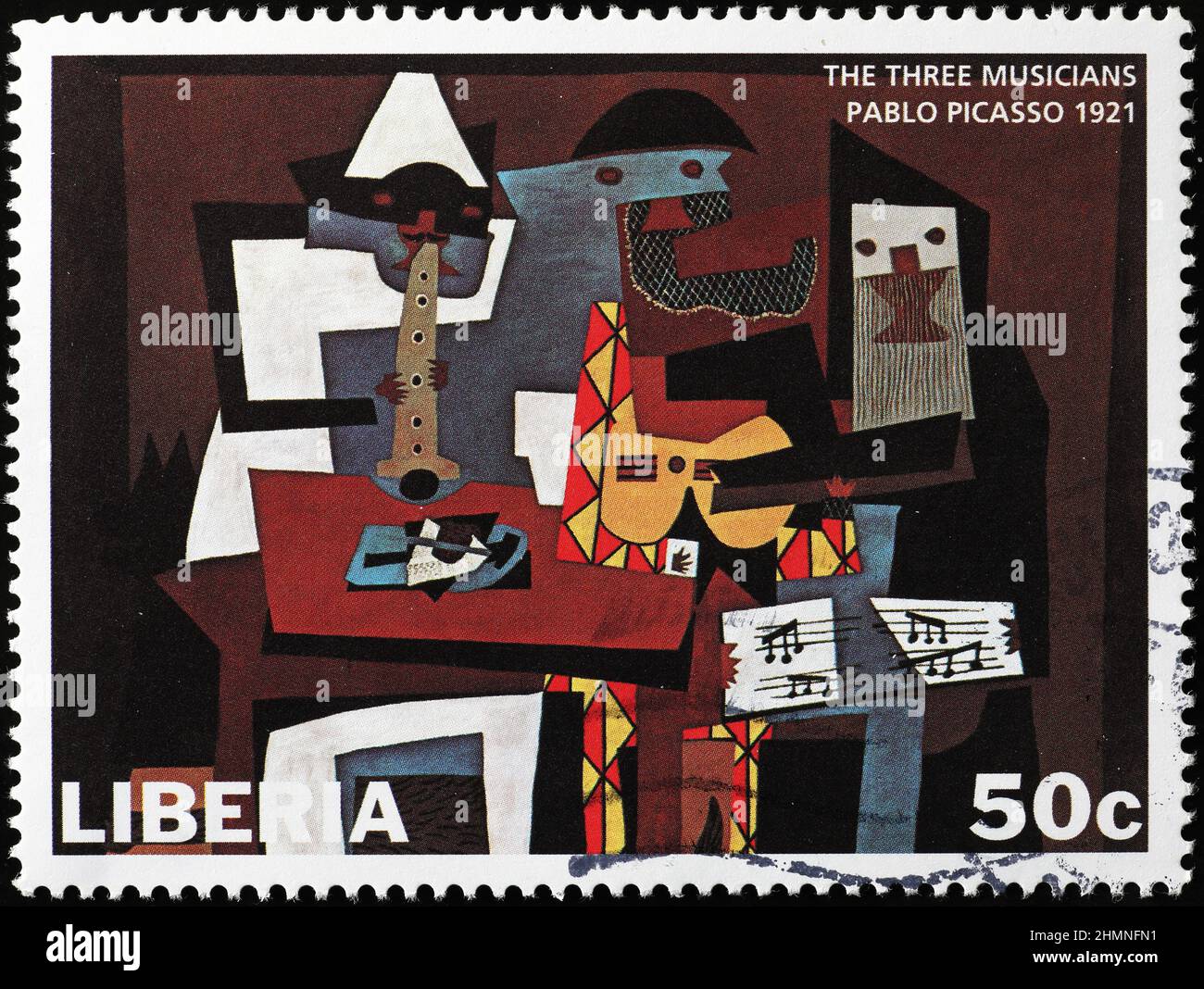 Los tres músicos de Pablo Picasso en sello postal Fotografía de stock