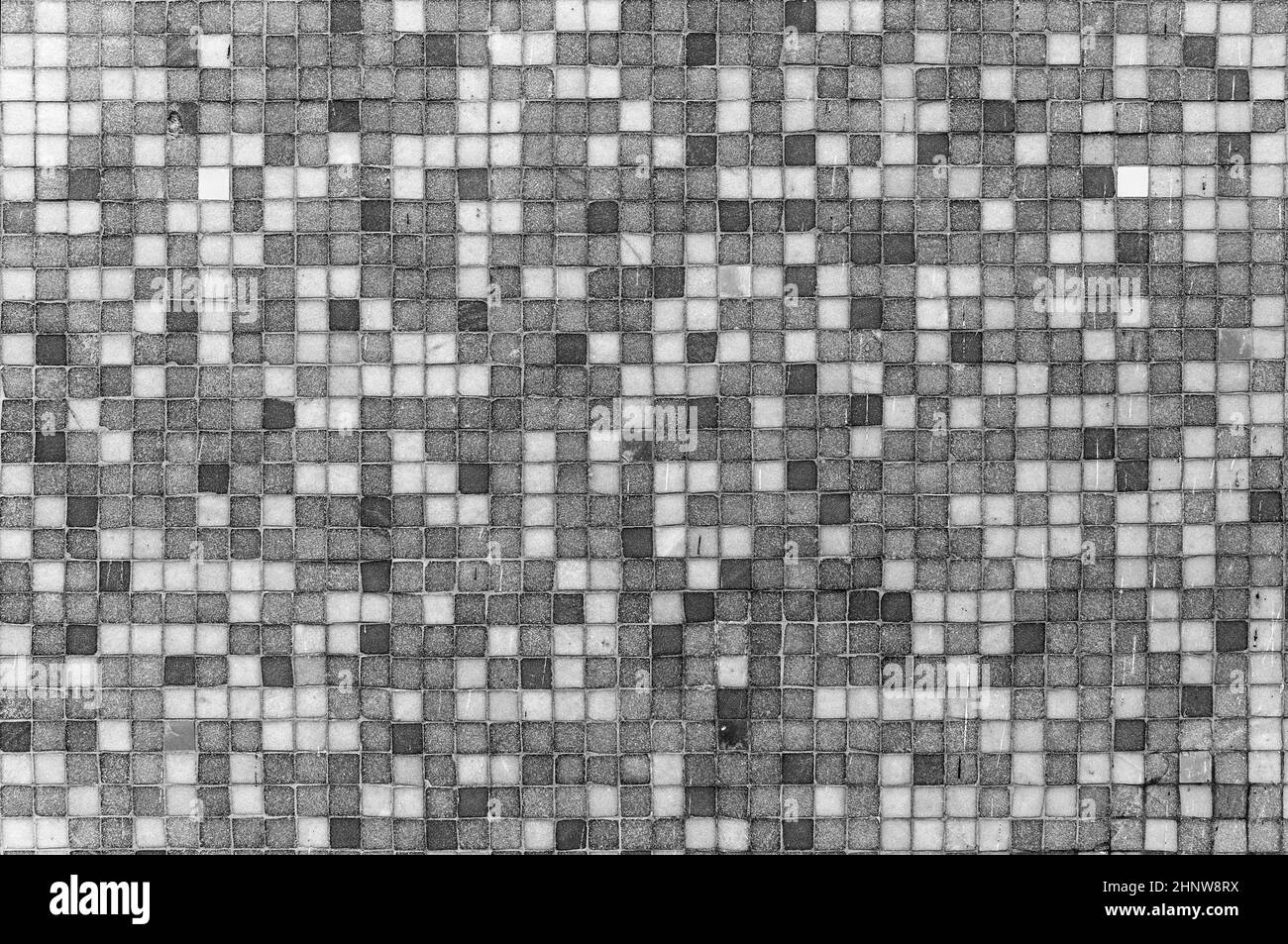 fondo armónico de pequeños cuadrados en diferentes colores grises Foto de stock