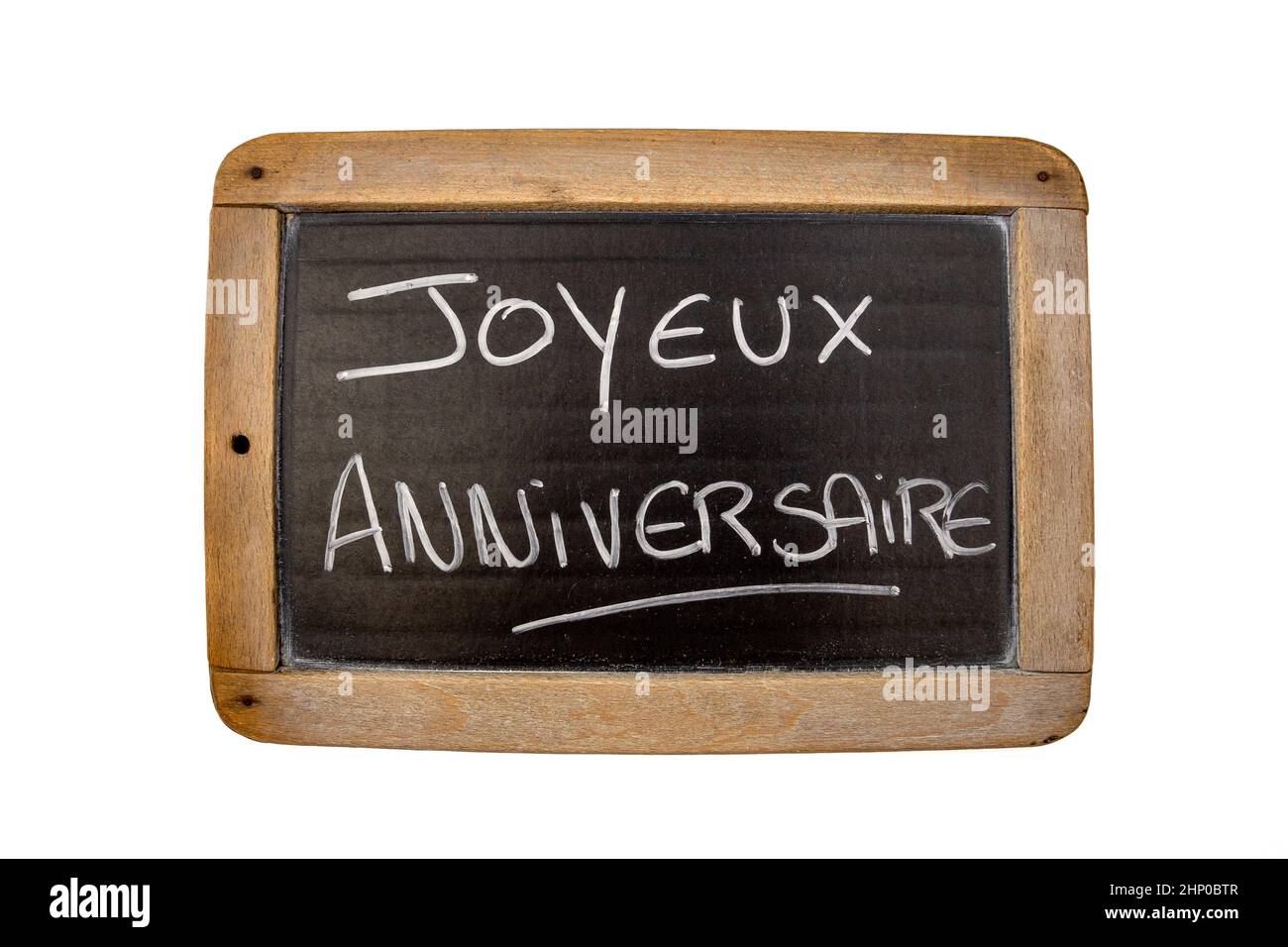 Inscripción en una pizarra en el aniversario de joyeux francés sobre un  fondo blanco Fotografía de stock - Alamy