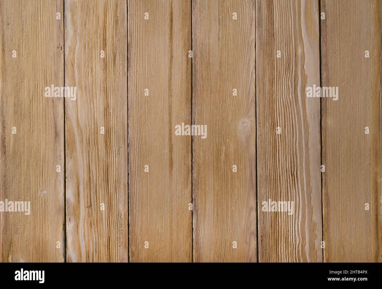 una pared de tablas texturizadas. el fondo está hecho de paneles de madera. Foto de stock