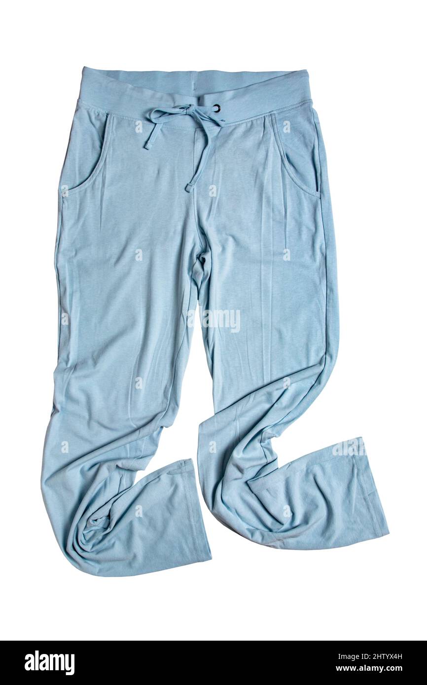 Pantalones de sudor aislados. Primer plano de las mujeres moderno pantalón sport azul o pantalón de punto aislado sobre un fondo blanco. Traje de jogging para el workou Foto de stock